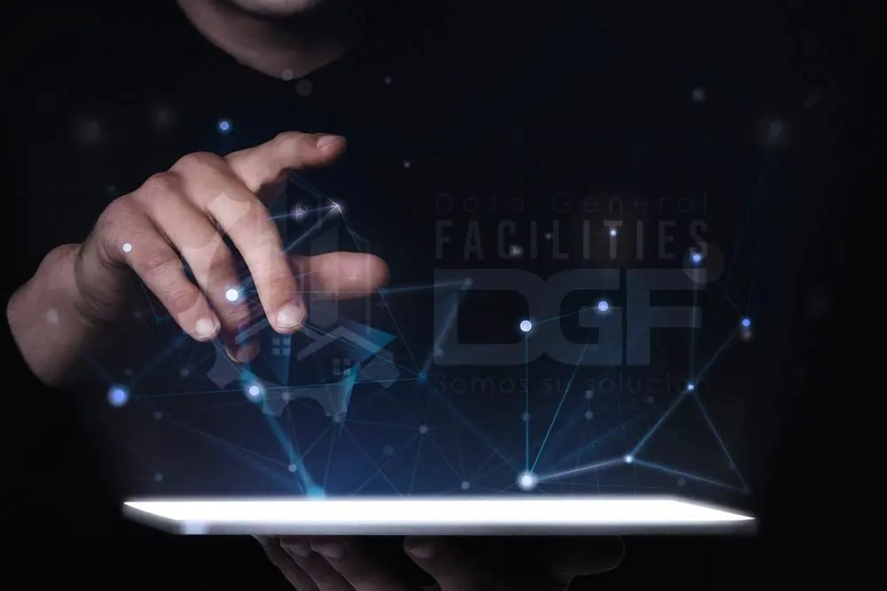 Hand over a screen with glowing network connections